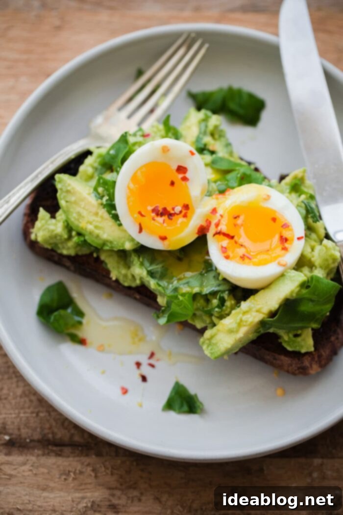 18 Scrumptious Brunch Recipes to Make Mom Smile 10 Gourmet Avocado Toast topped with soft boiled eggs, fresh basil, lemon, and chili flakes