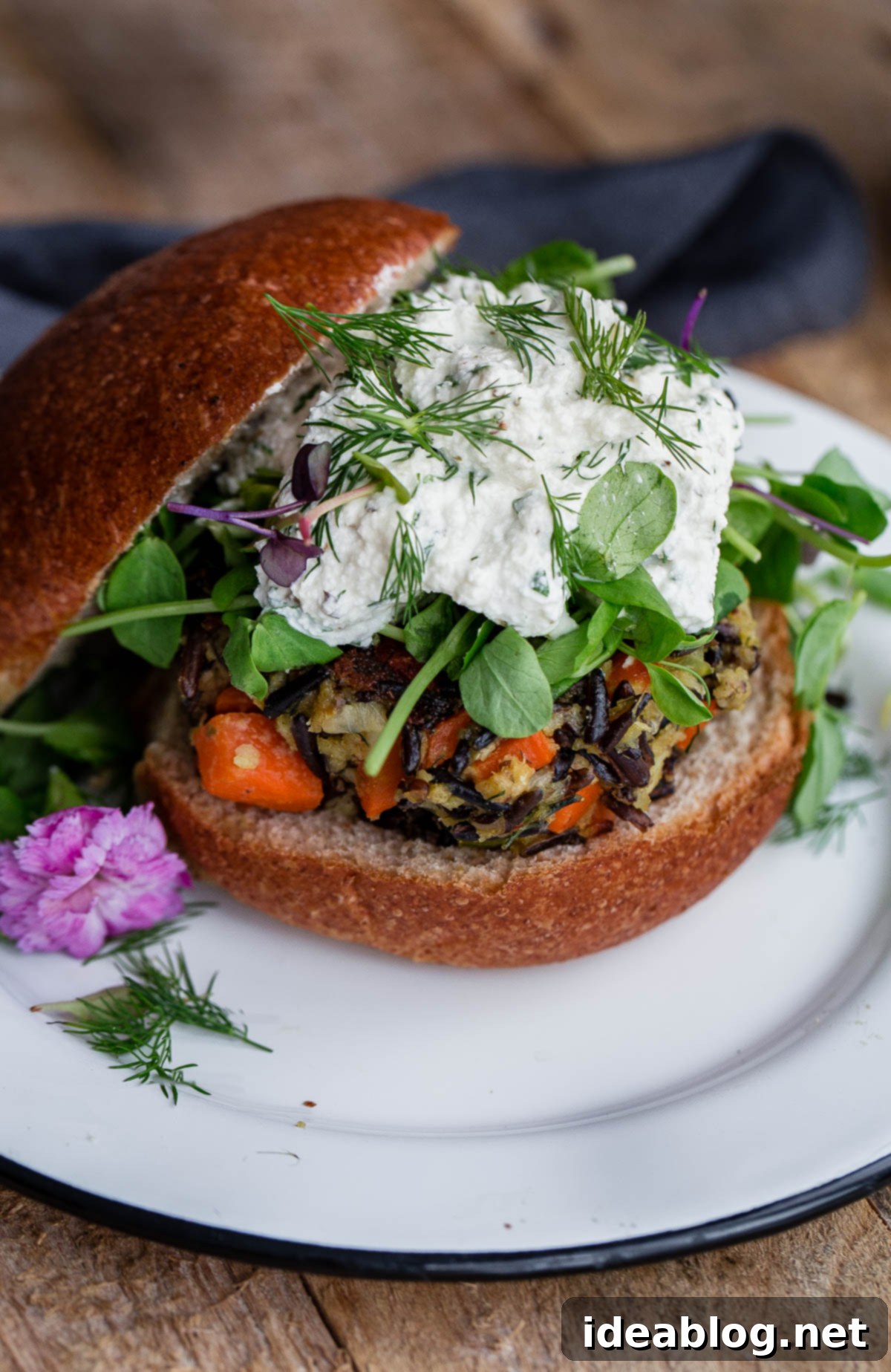 Savory Wild Rice Burgers with Creamy Herb Ricotta 9 Wild Rice Veggie Burgers with Herbed Ricotta, served beautifully with fresh herbs and a side of greens, highlighting a delicious vegetarian meal.