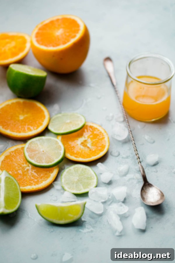 Spiced Pineapple Fizz 5 Sliced Oranges and Lime Pieces with Ice