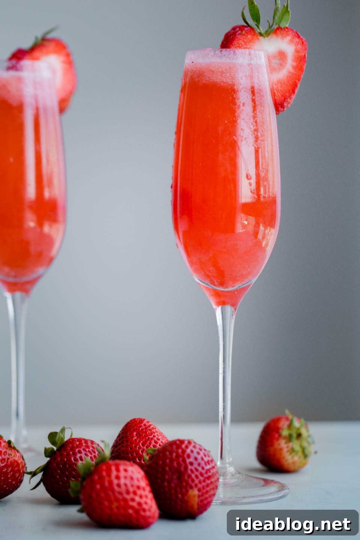Strawberry Elderflower Sparkler - a refreshing summer prosecco cocktail infused with fresh strawberry puree, elderflower liqueur, and vodka. Refreshing Strawberry Elderflower Prosecco Sparkler with fresh strawberries and elderflower liqueur
