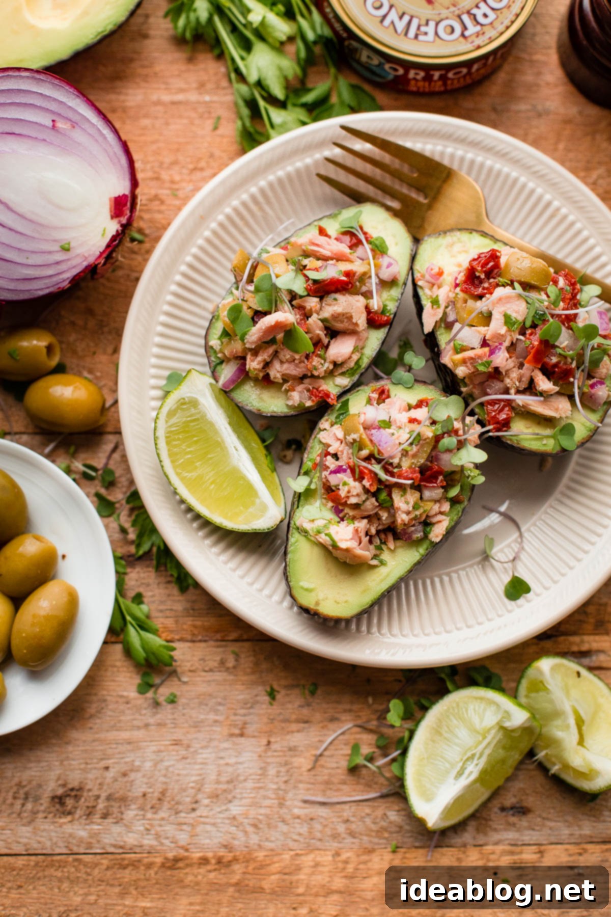 Avocado Tuna Pockets 7 Italian Tuna Avocado Boats - fresh tuna salad made with Bella Portofino extra virgin olive oil packed yellowfin tuna, olives, sundried tomatoes, parsley, and lime served in avocado boats. An easy, healthy, dairy free, gluten free, and paleo friendly recipe!