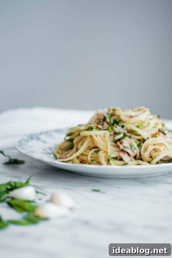 Tuna Pasta with Capers and Parsley - a fresh and EASY weeknight pasta recipe made with canned tuna! #pasta #recipe #abeautifulplate #italianrecipes #tunafish Tuna Pasta
