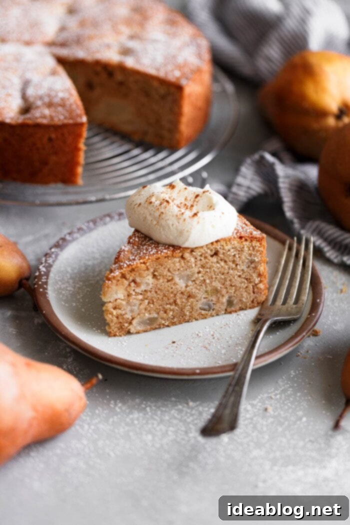 Cozy Fall Cooking: 10 Delightful Recipes 4 Slice of Spiced Almond Pear Cake with Whipped Cream