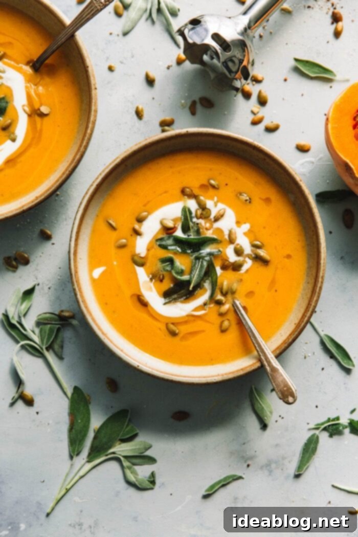 Cozy Fall Cooking: 10 Delightful Recipes 7 Creamy Roasted Butternut Squash Soup garnished with Sage and Pumpkin Seeds