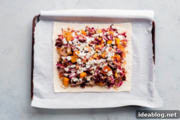 Sweet & Savory Butternut Radicchio Feta Tart 10 Adding the final layer of filling and feta to the butternut squash pie