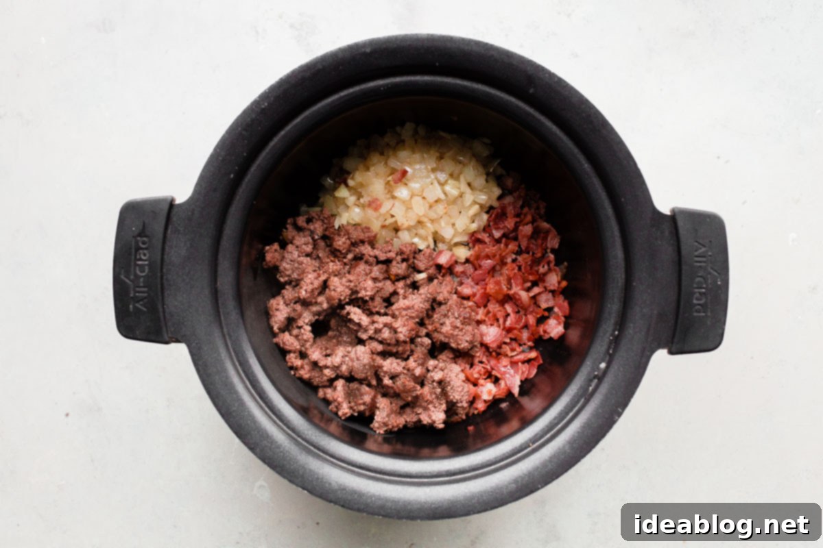 Deep-Flavor Bolognese Ragu 9 Ground beef browning in a hot skillet for the slow cooker bolognese sauce.