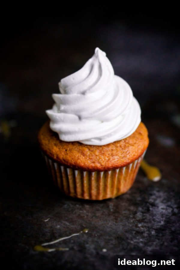 Fluffy Pumpkin Cloud Cupcakes 4 EASY Pumpkin Cupcakes topped with marshmallow frosting!