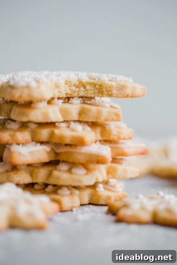 Tender Almond Sugar Cookies with Sweet Glaze 2 Almond Sugar Cookies - delicious crisp, tender, and buttery sugar cookies made with almond meal and flavored with almond extract and fresh orange zest. Topped with a simple cookie icing!