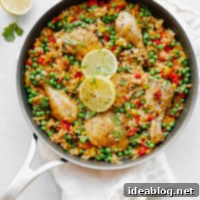 Savory Chicken & Rice Harmony 6 Arroz Con Pollo - an easy, comforting ONE pot meal that comes together in less than 45 minutes. This classic Spanish and Mexican dish is made with rice, chicken, bell peppers, and spices.