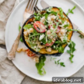 Wholesome Mediterranean Quinoa-Stuffed Acorn Squash 4 Close-up of a beautifully stuffed acorn squash with quinoa salad, ready to be enjoyed.