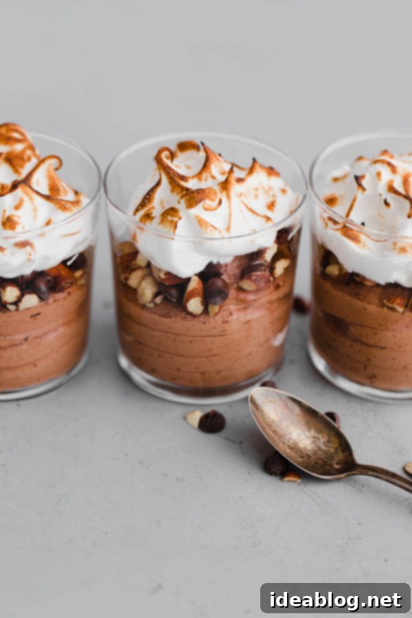 Chocolate Mousse Parfait with Toasted Meringue Easy Chocolate Mousse layered with toasted meringue and roasted almonds in a cup.