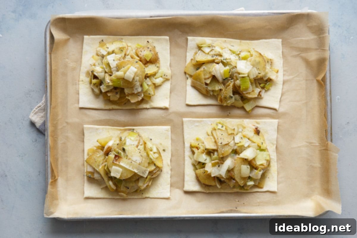 Golden Potato Leek Cornish Pasty 8 Puff pastry rectangles with potato leek filling and cheddar cheese, ready for the top layer