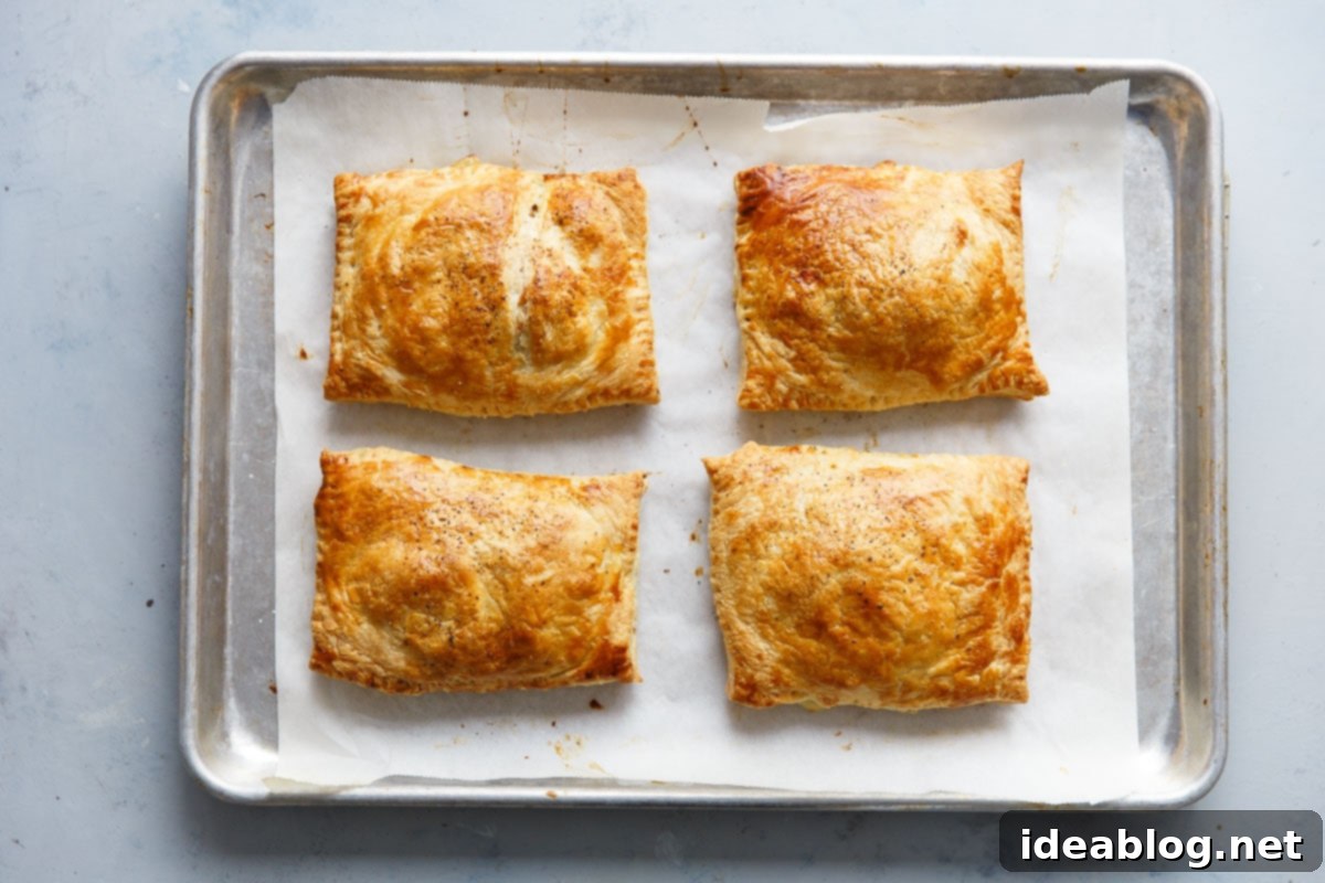 Golden Potato Leek Cornish Pasty 10 Freshly baked golden Potato Leek Cornish Pasties on a cooling rack, ready to serve