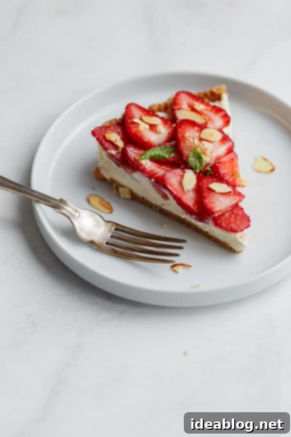 Luscious Strawberry Mascarpone Tart 4 No Bake Strawberry Tart, a slice removed showing layers of crust, filling, and fruit