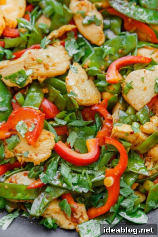 Easy Chicken Snow Pea Stir Fry - Quick and healthy chicken and snow pea stir fry with bell peppers, ginger, and garlic. Easy Chicken Snow Pea Stir Fry