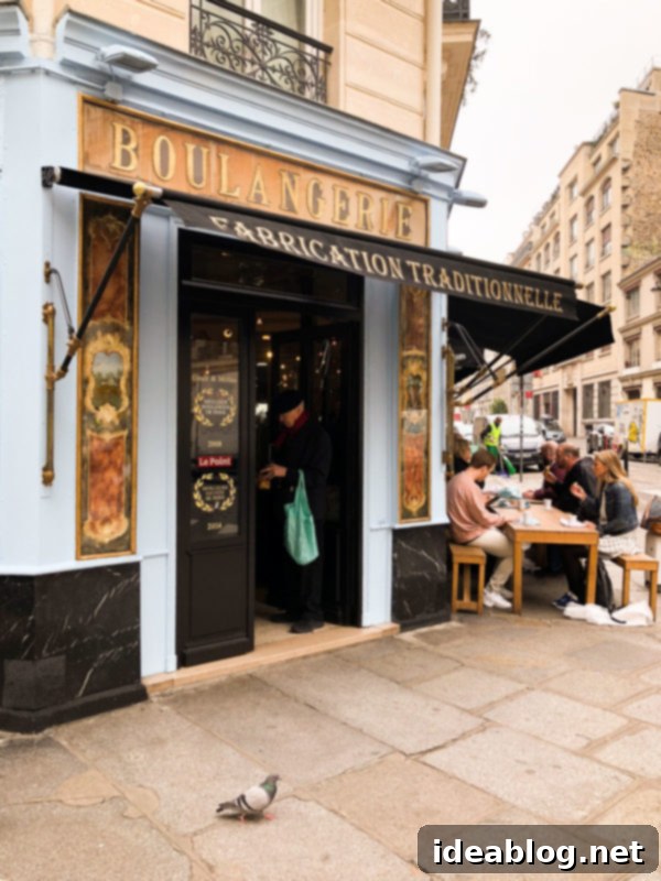 The Taste of Paris: Your Dining Companion 13 The charming exterior of Du Pain Et Des Idees bakery in Paris.
