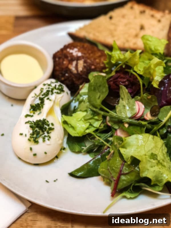 The Taste of Paris: Your Dining Companion 30 A hearty breakfast plate with eggs and sausage at Holybelly Cafe Paris.