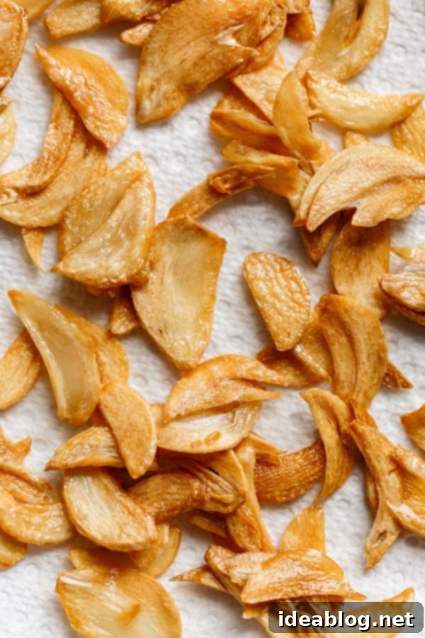 Zesty Burmese Chicken Salad 3 Golden brown and perfectly crispy fried garlic chips, a key ingredient for adding texture and deep flavor to the Burmese Chicken Salad.