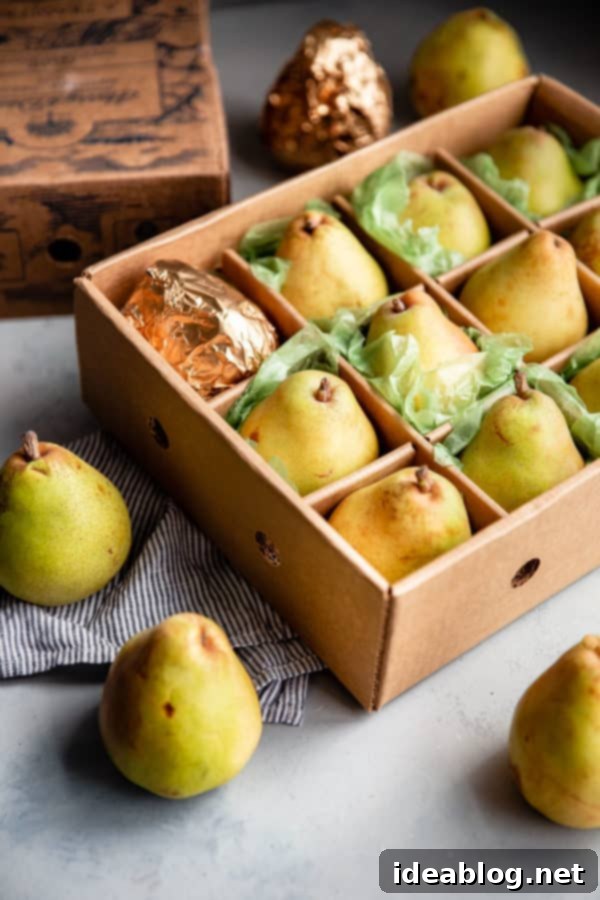 Elegant Pear & Almond Tart 3 Assortment of fresh Harry and David Royal Riviera Pears, known for their buttery texture and exceptional sweetness, perfect for poaching in a classic French tart