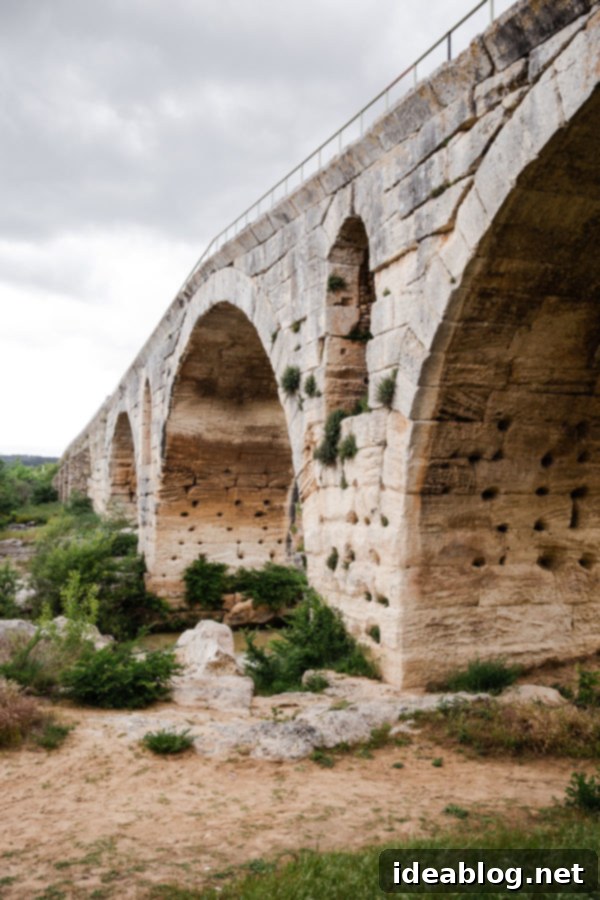 Provence France travel guide, focused on the Luberon, with recommendations on must-visit destinations, where to stay, and where to eat in the region. #travel #france #travelguide #abeautifulplate #provence The ancient Roman Pont Julien bridge near Bonnieux