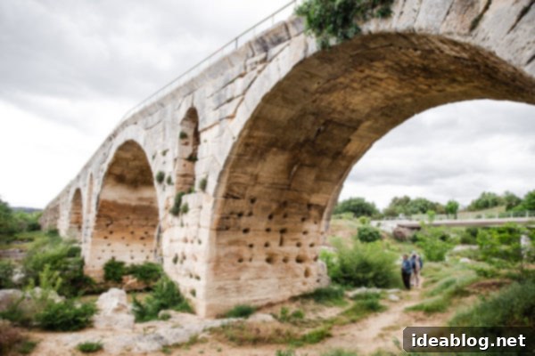 Provence France travel guide, focused on the Luberon, with recommendations on must-visit destinations, where to stay, and where to eat in the region. #travel #france #travelguide #abeautifulplate #provence Ancient Roman Bridge, Pont Julien in Provence