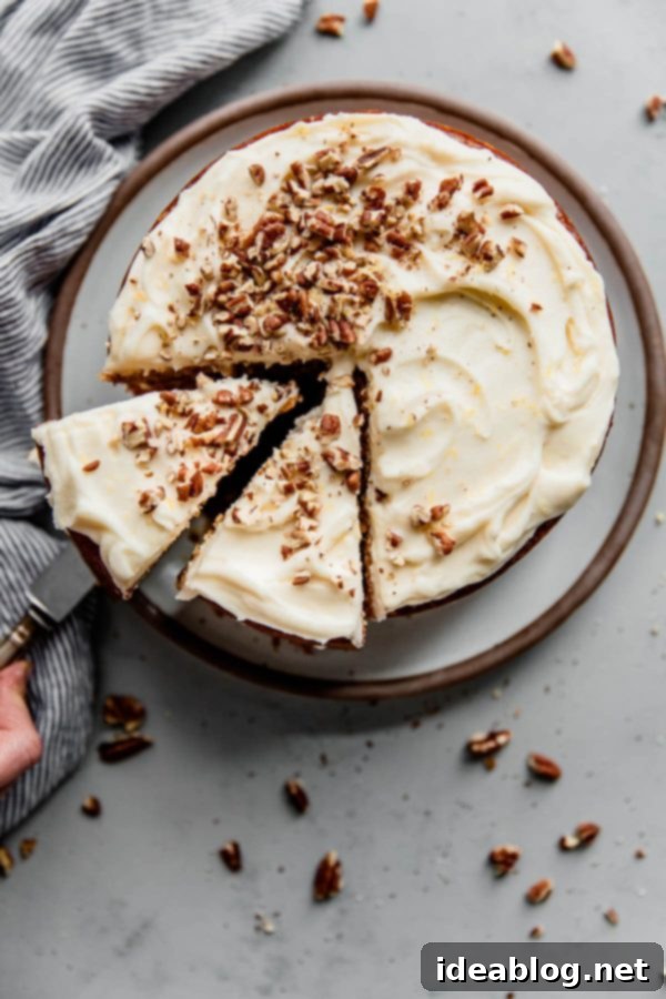 Moist Carrot Cake with Zesty Lemon Cream Cheese Frosting 3 Beautifully Sliced Two-Layer Carrot Cake Ready to Serve