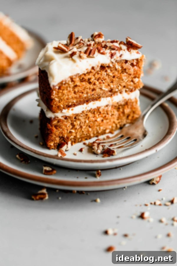Perfectly Sliced Carrot Cake: A Delightful Blend of Flavors A Generous Slice of Homemade Carrot Cake with Cream Cheese Frosting
