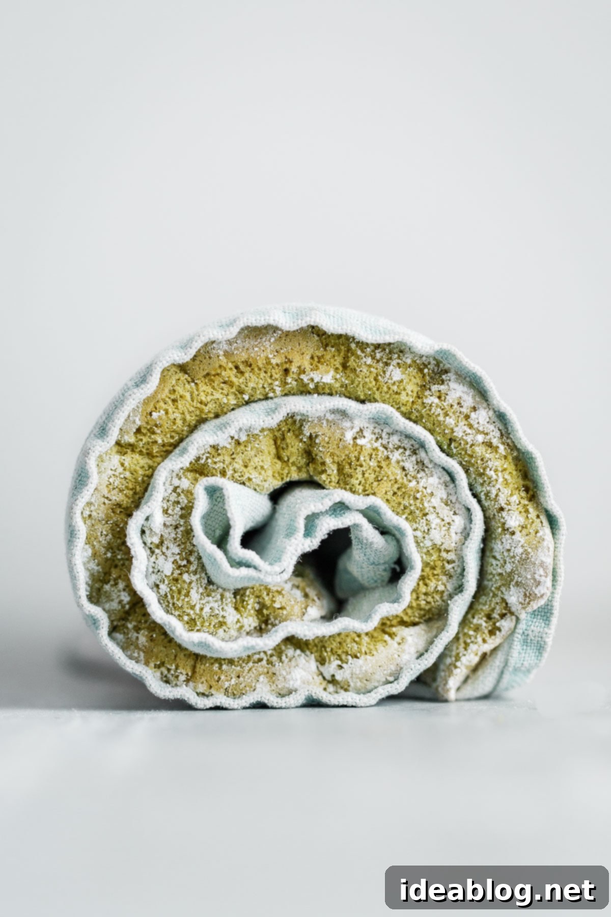 Vibrant Raspberry Matcha Roll Cake 4 Unrolled Matcha Roll Cake with vibrant green color