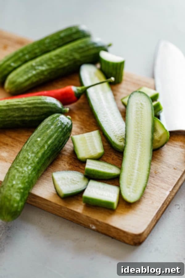 Chinese Cucumber Salad Ingredients - A simple, refreshing, spicy, smashed cucumber salad made with smashed cucumbers, sesame oil, soy sauce, rice vinegar, and chili peppers. #easyrecipe #chinesecuisine #cucumber #salad #glutenfree #vegetarian Smashed Chinese Cucumber Salad Ingredients in Bowls