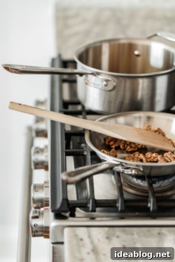 Walnuts in a Skillet - illustrating preparation of French Lentil Salad ingredients.