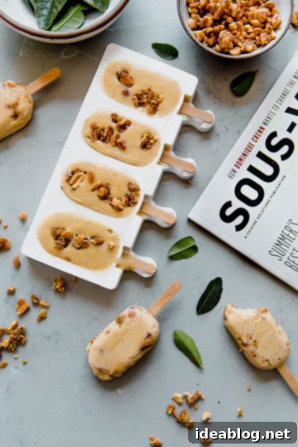 Honey Peanut Butter Custard Popsicles - creamy peanut butter custard popsicles, prepared filled with candied peanut clusters! This sous vide custard recipe is prepared in an an immersion circulator to create a smooth texture and pasteurize the eggs for safe eating. Sponsored by @cuisinesolutions. #ILOVESOUSVIDE #sousvidemagazine #dessert #popsicle #custard #peanutbutter #easyrecipes #sousvide Sous Vide Honey Peanut Butter Popsicles
