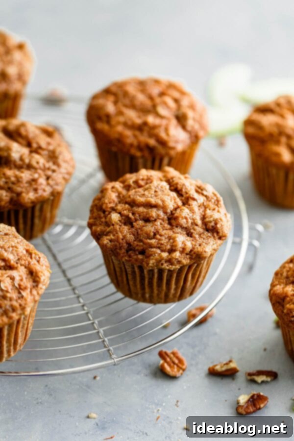 Fluffy Whole Wheat Apple Cinnamon Muffins with Coconut Sugar and Pecans Whole Wheat Apple Cinnamon Muffins - these fluffy apple cinnamon muffins, prepared with whole wheat flour, get their amazing fluffy and moist texture from buttermilk, grated apple, and avocado oil. Lightly sweetened with coconut sugar and studded with chopped pecans, this whole wheat muffin recipe is sure to be a hit during the fall season! Sponsored by Bob's Red Mill. #abeautifulplate #muffin #recipe #apple #cinnamon