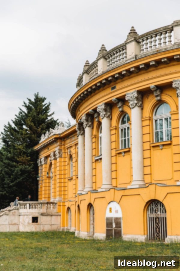 Budapest Travel Guide - with recommendations on must-visit destinations, where to stay, and where to eat in the region. #travel #budapest #travelguide Szechenyi Thermal Bath outdoor pools with steam rising