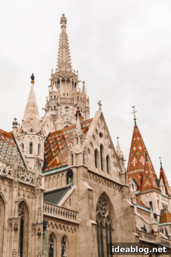 Budapest Travel Guide - with recommendations on must-visit destinations, where to stay, and where to eat in the region. #travel #budapest #travelguide Matthias Church, Budapest with its distinct roof tiles