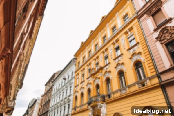 Budapest Travel Guide - with recommendations on must-visit destinations, where to stay, and where to eat in the region. #travel #budapest #travelguide Colorful residential buildings in Budapest