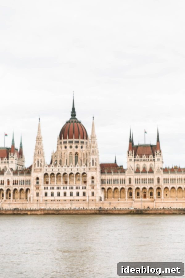 Budapest Travel Guide - with recommendations on must-visit destinations, where to stay, and where to eat in the region. #travel #budapest #travelguide Hungarian Parliament Building illuminated at night across the Danube