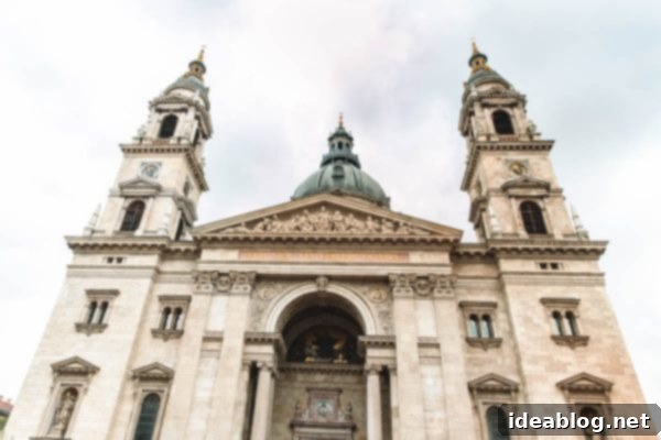 Budapest Travel Guide - with recommendations on must-visit destinations, where to stay, and where to eat in the region. #travel #budapest #travelguide St. Stephen's Basilica facade at night