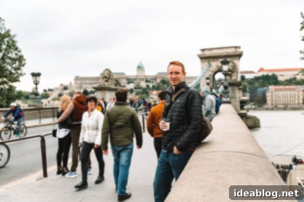 Budapest Travel Guide - with recommendations on must-visit destinations, where to stay, and where to eat in the region. #travel #budapest #travelguide Chain Bridge and illuminated buildings along the Danube River at dusk