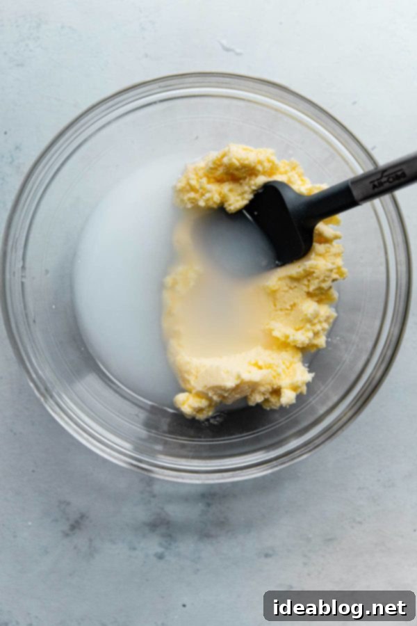 The Art of Cultured Butter 6 Homemade cultured butter being kneaded and pressed in a bowl of very cold water to wash away residual buttermilk.