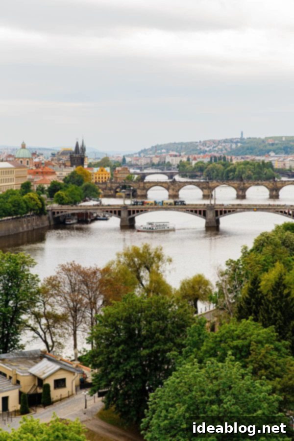 Prague River - a beautiful view from the city. #travel #prague #travelguide Prague River with boats and historical buildings