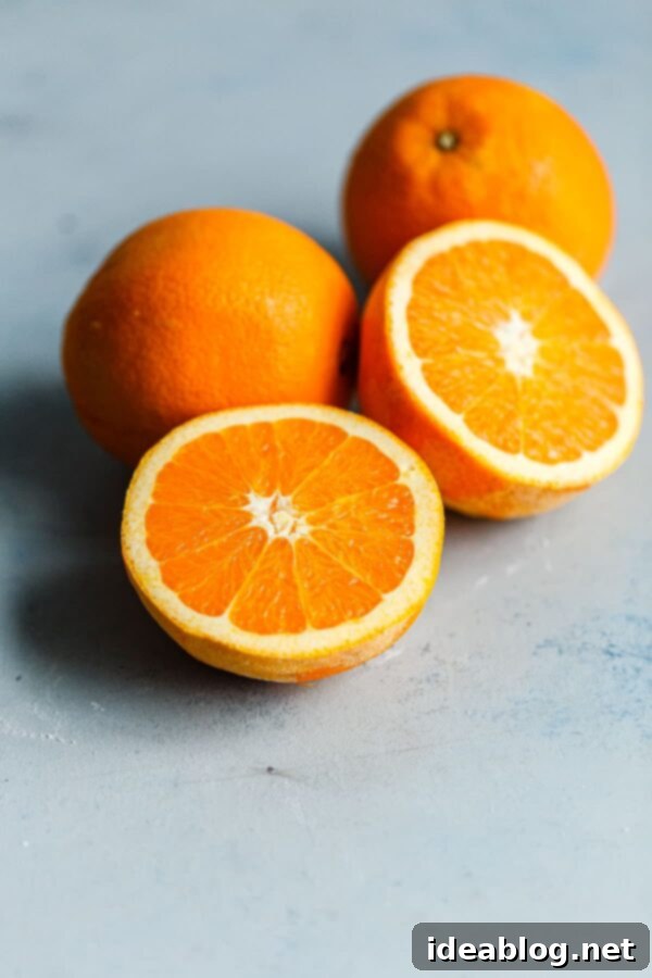 Zesty Orange Bundt with Chocolate Drizzle 3 Navel Oranges - Fresh, vibrant navel oranges, essential for zesting and juicing.