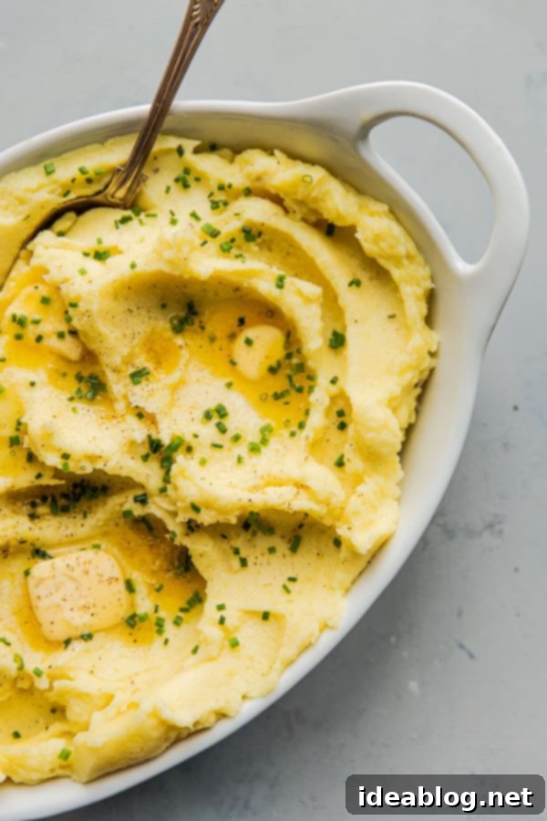 Buttery Smooth Yukon Gold Mashed Potatoes 5 Mashed Potatoes Heating in a Pot on the Stove