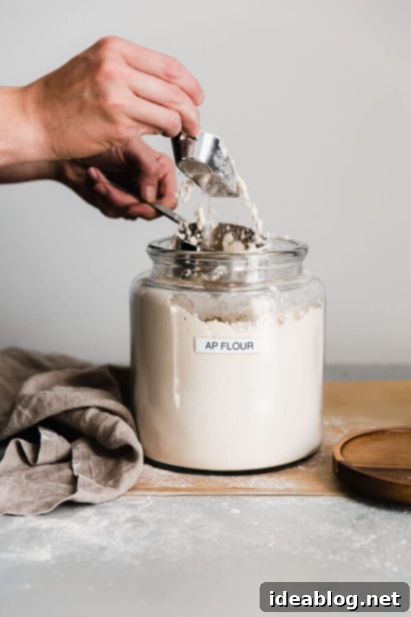 How to Measure Flour Properly - guide on how to measure flour properly - using both volume and metric measurements - as well as how and why the type of method impacts your baked goods. #baking #abeautifulplate #howto #bakingscience How to Measure Flour