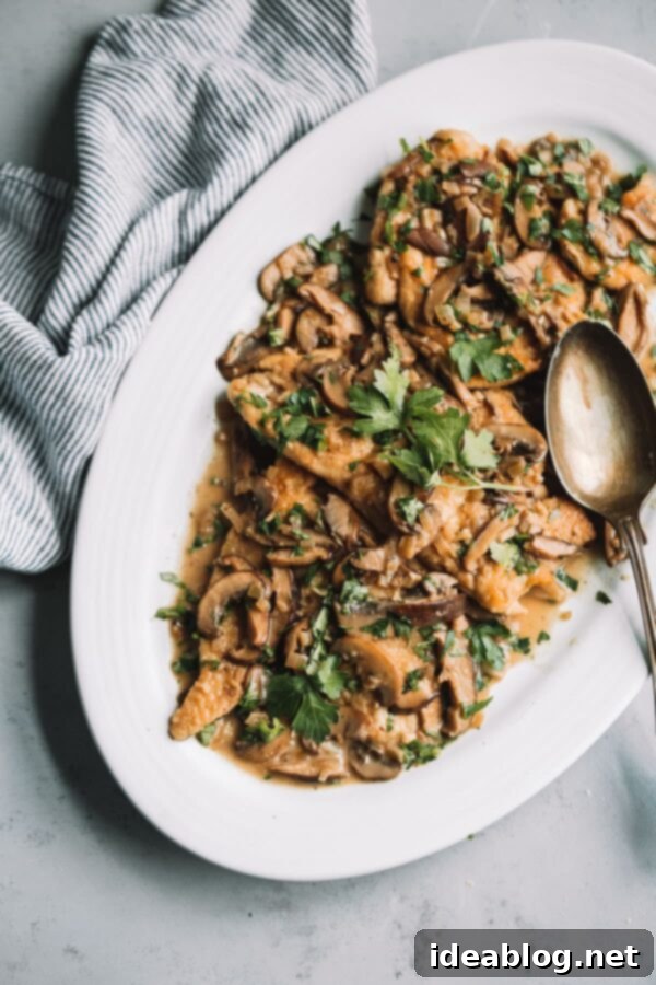 Healthier Chicken Marsala - Tender chicken cutlets with a creamy mushroom and Marsala wine sauce. Delicious Healthier Chicken Marsala with Mushrooms and Parsley
