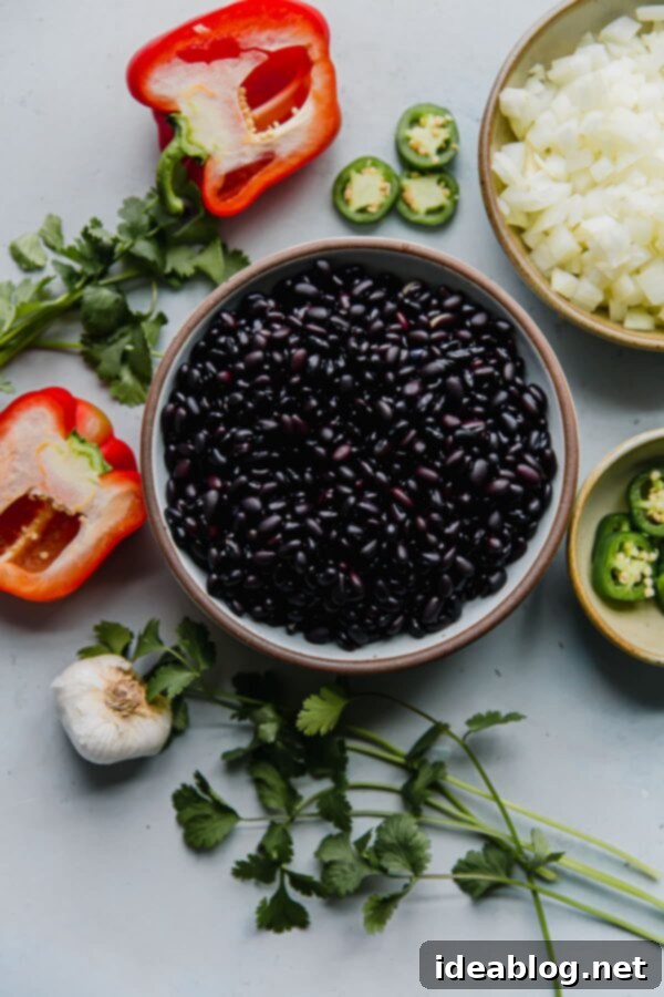 No-Soak Instant Pot Black Beans 2 Instant Pot black bean recipe ingredients laid out, including dried beans, vegetables, and spices.