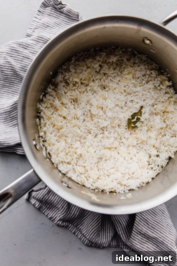 How to Make Perfectly Cook Basmati Rice Pilaf - moist and flavorful basmati rice prepared on the stovetop. #rice #basmati #howto #recipe #abeautifulplate Uncooked Basmati Rice in Stainless Steel Pot Before Cooking