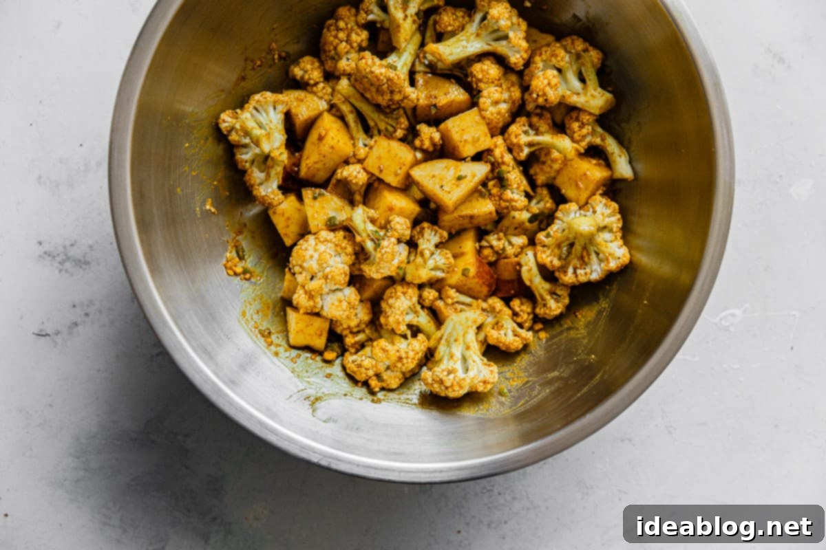 One-Pan Cauliflower Curry with Refreshing Raita 7 Cauliflower Florets and Curry Spice Mixture in Bowl