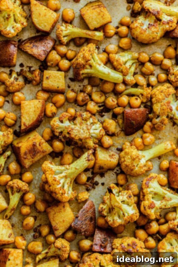 One-Pan Cauliflower Curry with Refreshing Raita 3 Sheet Pan Cauliflower Curry with Chickpeas - golden and crispy