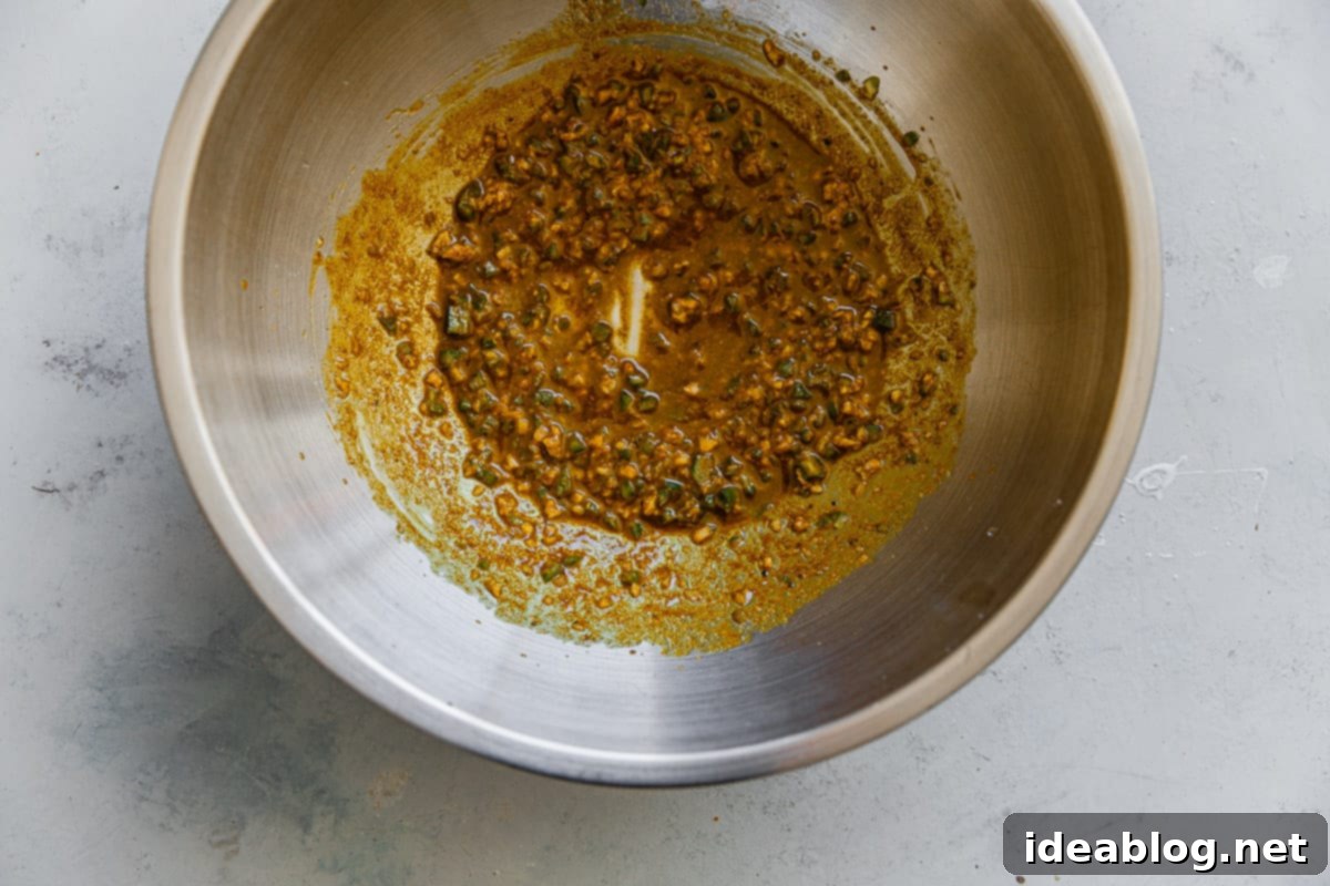 One-Pan Cauliflower Curry with Refreshing Raita 5 Curried Oil Mixture in Bowl
