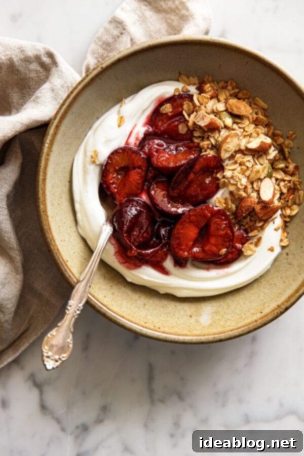 Slow-Roasted Plum Compote 2 Roasted Plum Compote with Yogurt and Granola in a Ceramic Bowl